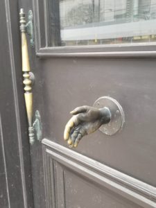 hand sculpture on a door 