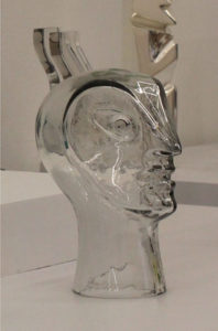 Head shaped glass sculpture wearing a helmet